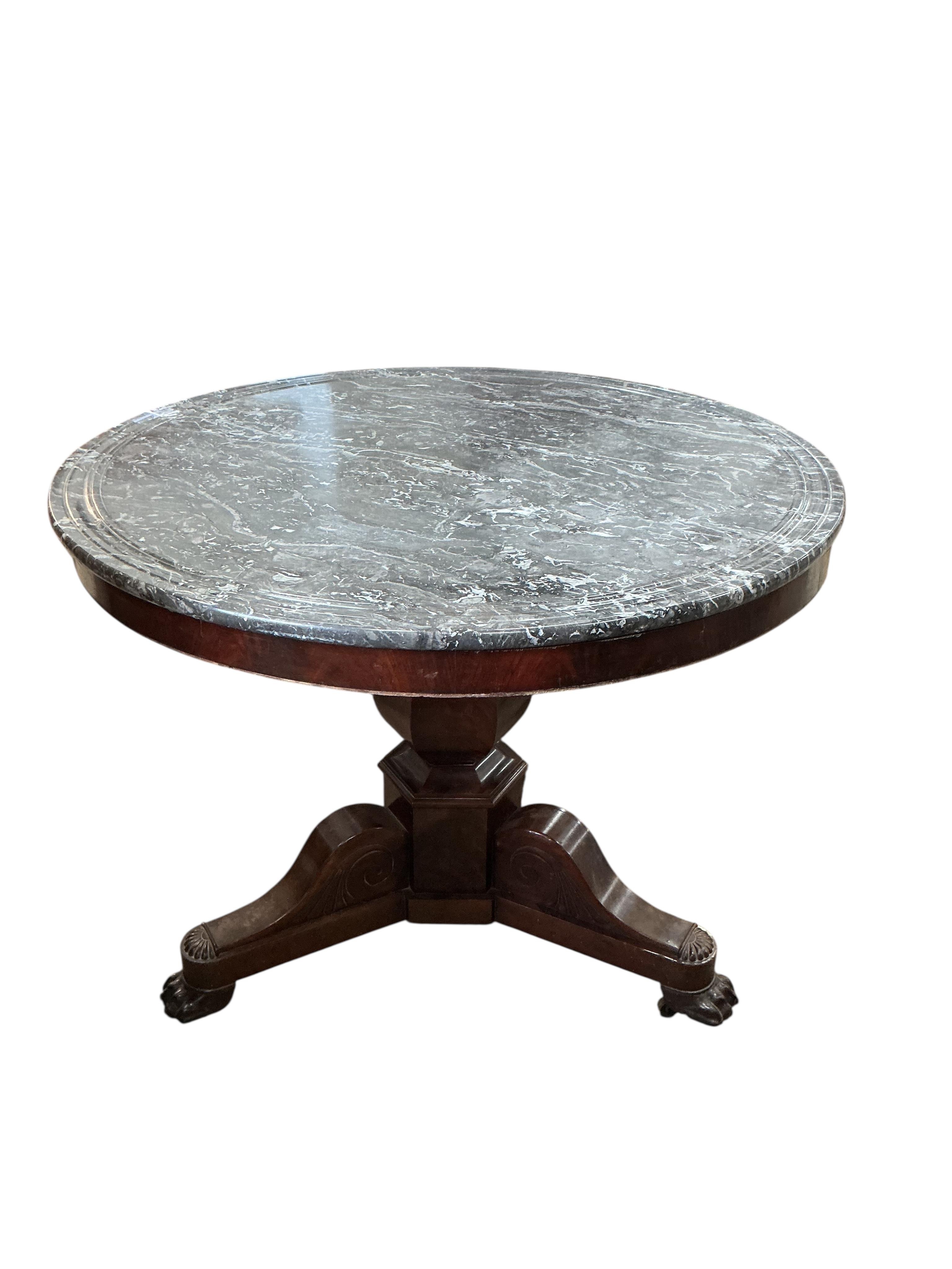 A French Empire circular marble top mahogany centre table, diameter 98cm, height 77cm